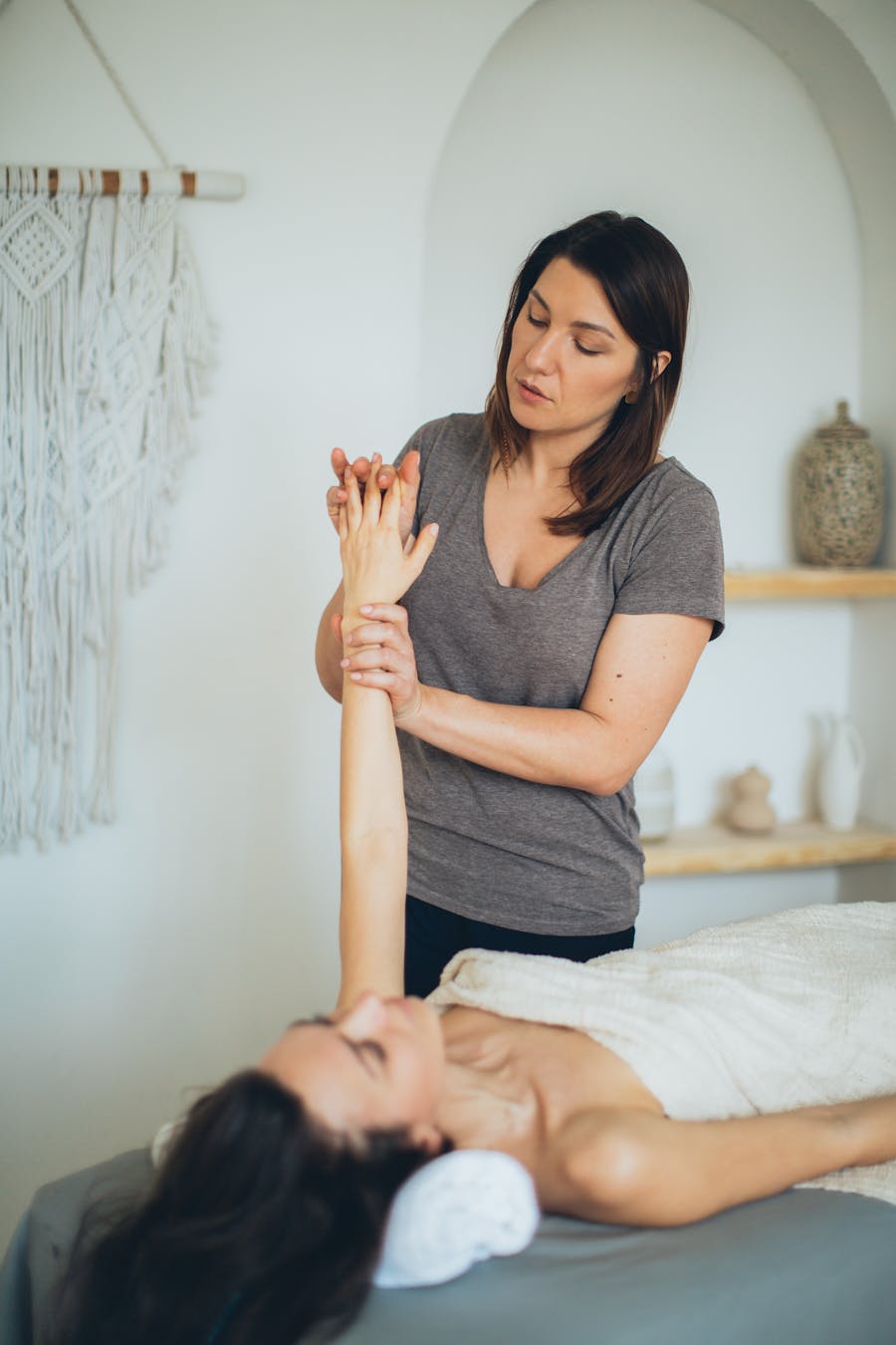 Wellness practitioner with client